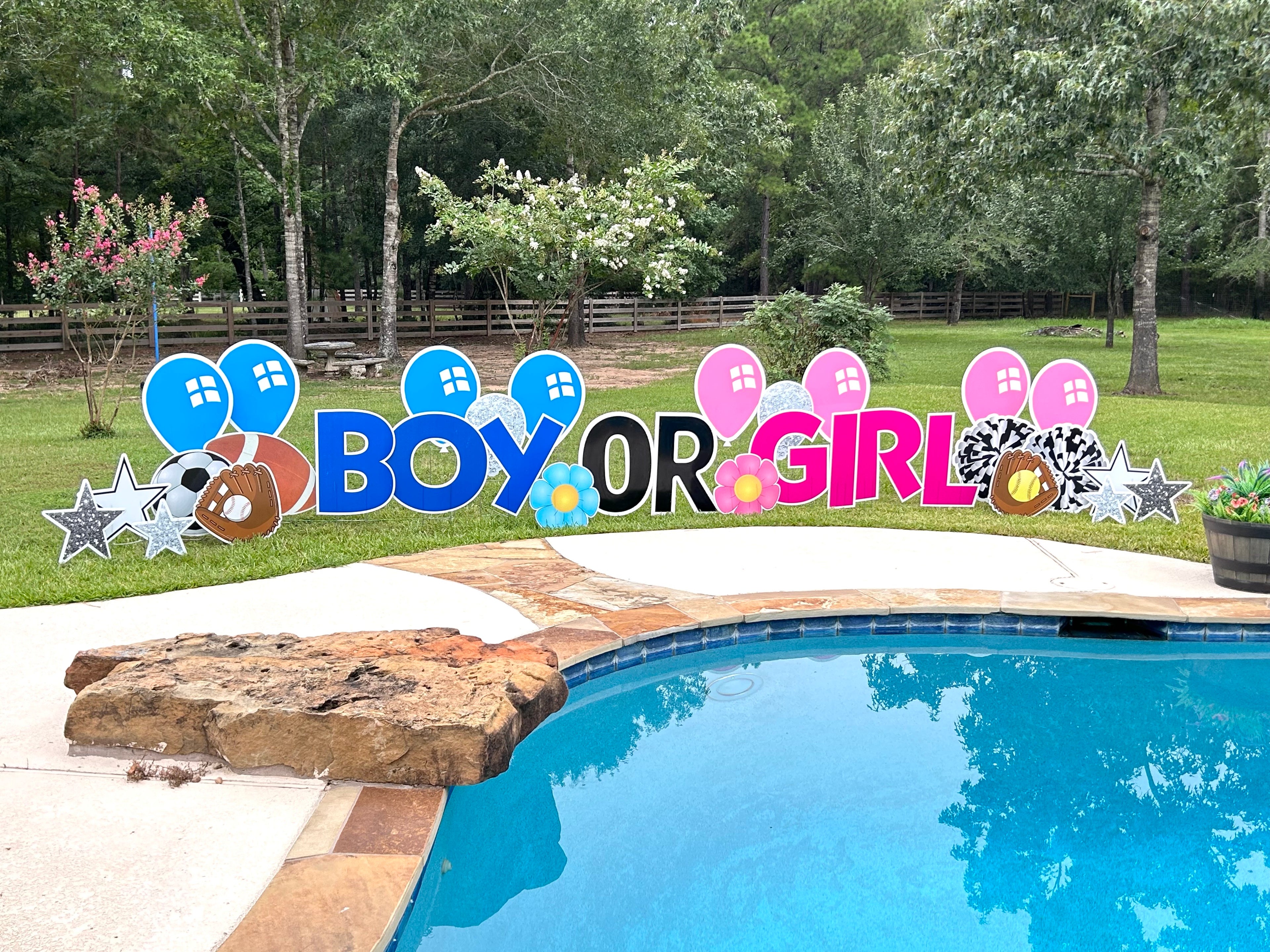 An exciting yard card display by Texas Party in the Yard, perfect for a gender reveal party. The setup includes "Boy or Girl?" with pink and blue-themed graphic images like footballs and pom poms, arranged in a yard in Montgomery, TX.