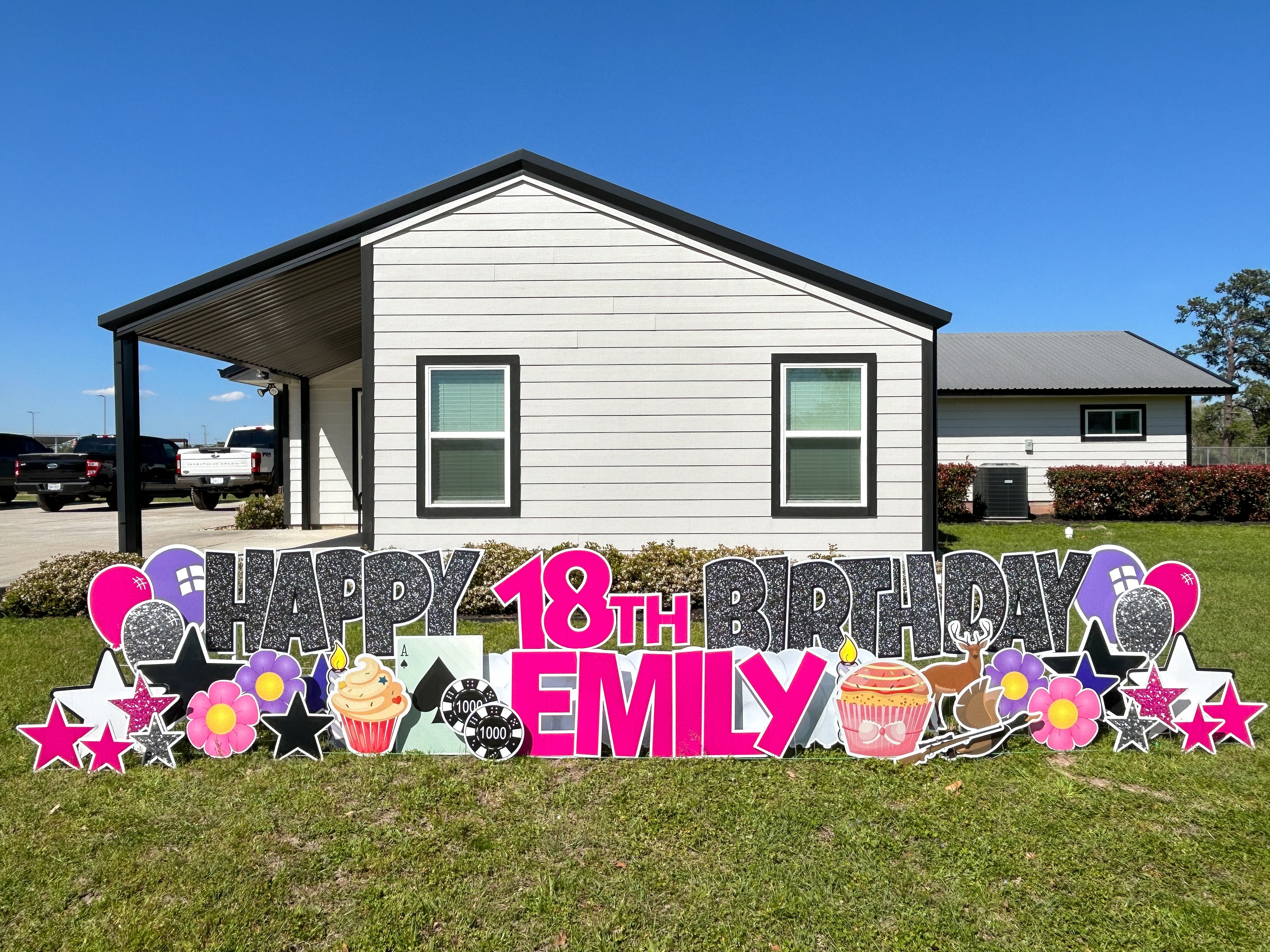 bright and colorful 18th birthday yard card rental with poker and hunting graphics in Montgomery, TX
