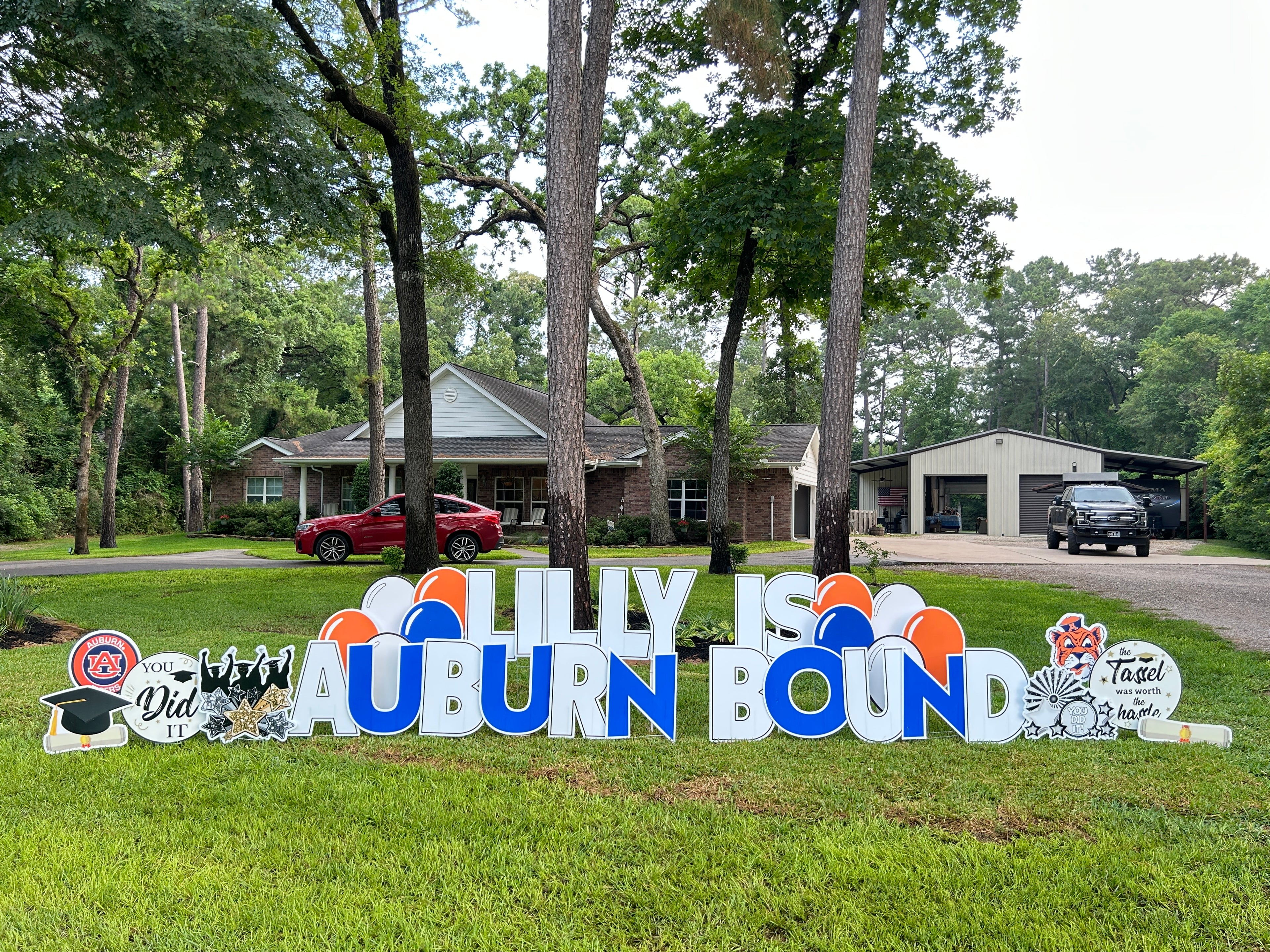 Personalized grad yard card sign for graduate with school colors and mascot in Magnolia, Tx.